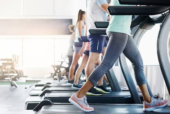 people walking on treadmill